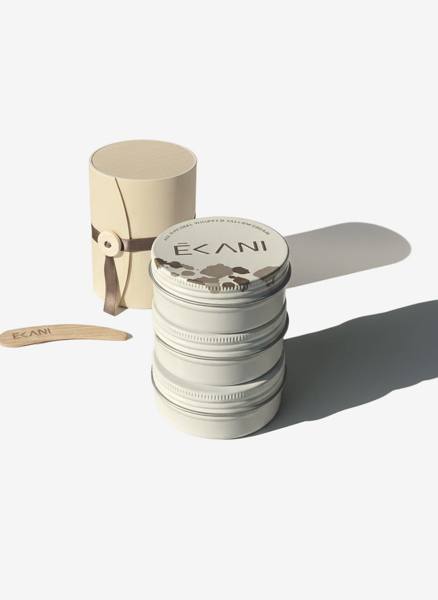 Ecani skincare product with packaging on a white background grass-fed beef tallow face cream in tin jar